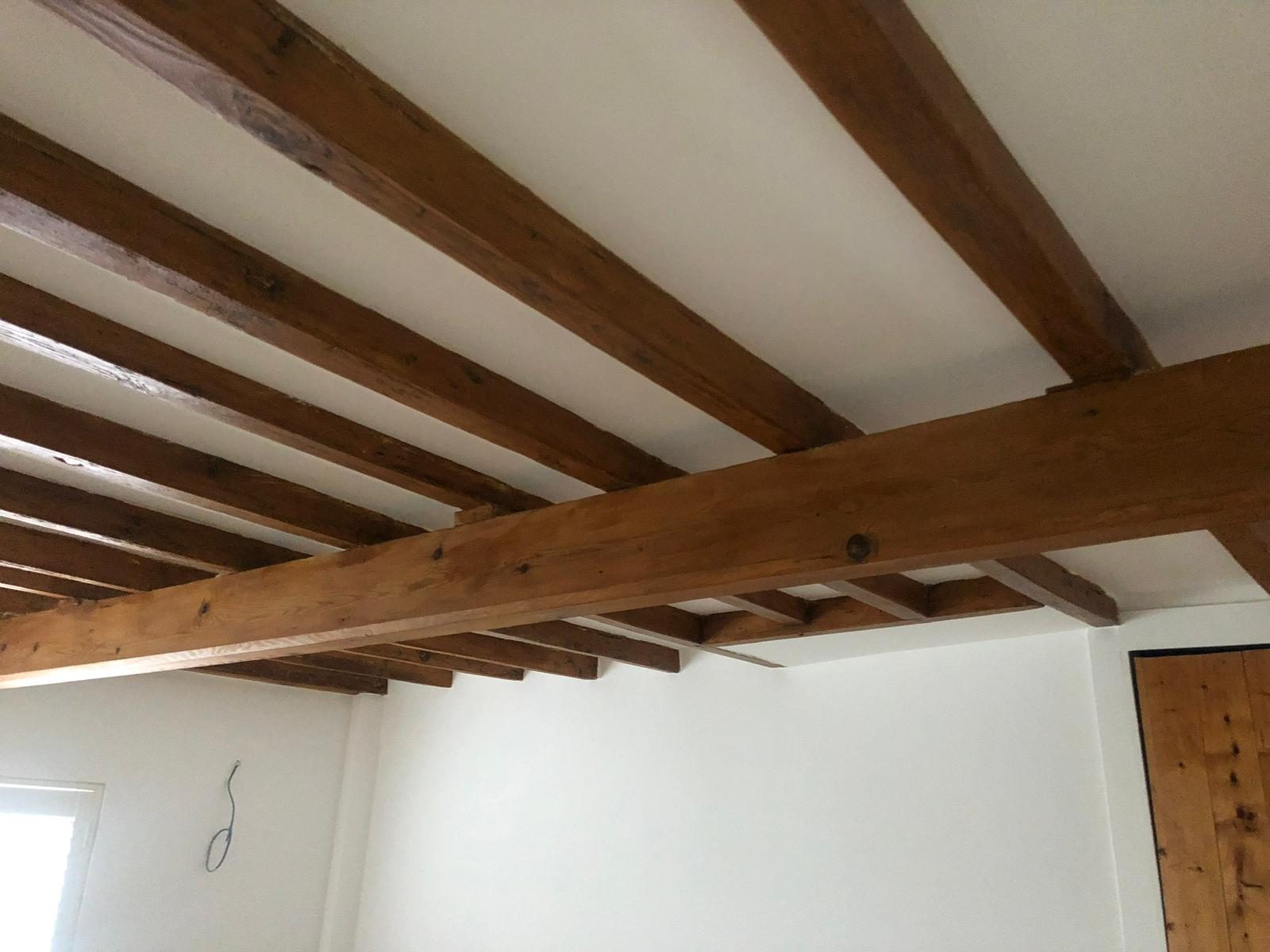 Period beam ceiling with crisp plastered surrounds, ready for paint